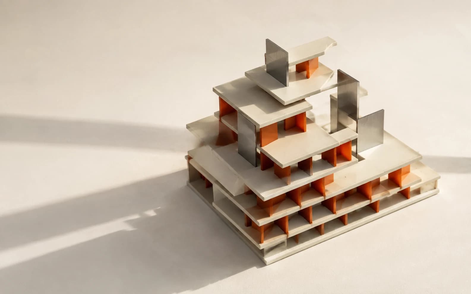 Conceptual artwork: ivory architectural layers with orange inserts and steel fins.